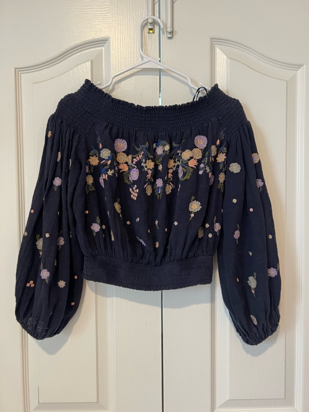 Free People Embroidered Off-Shoulder Women’s Top - Navy with Floral Stitching.